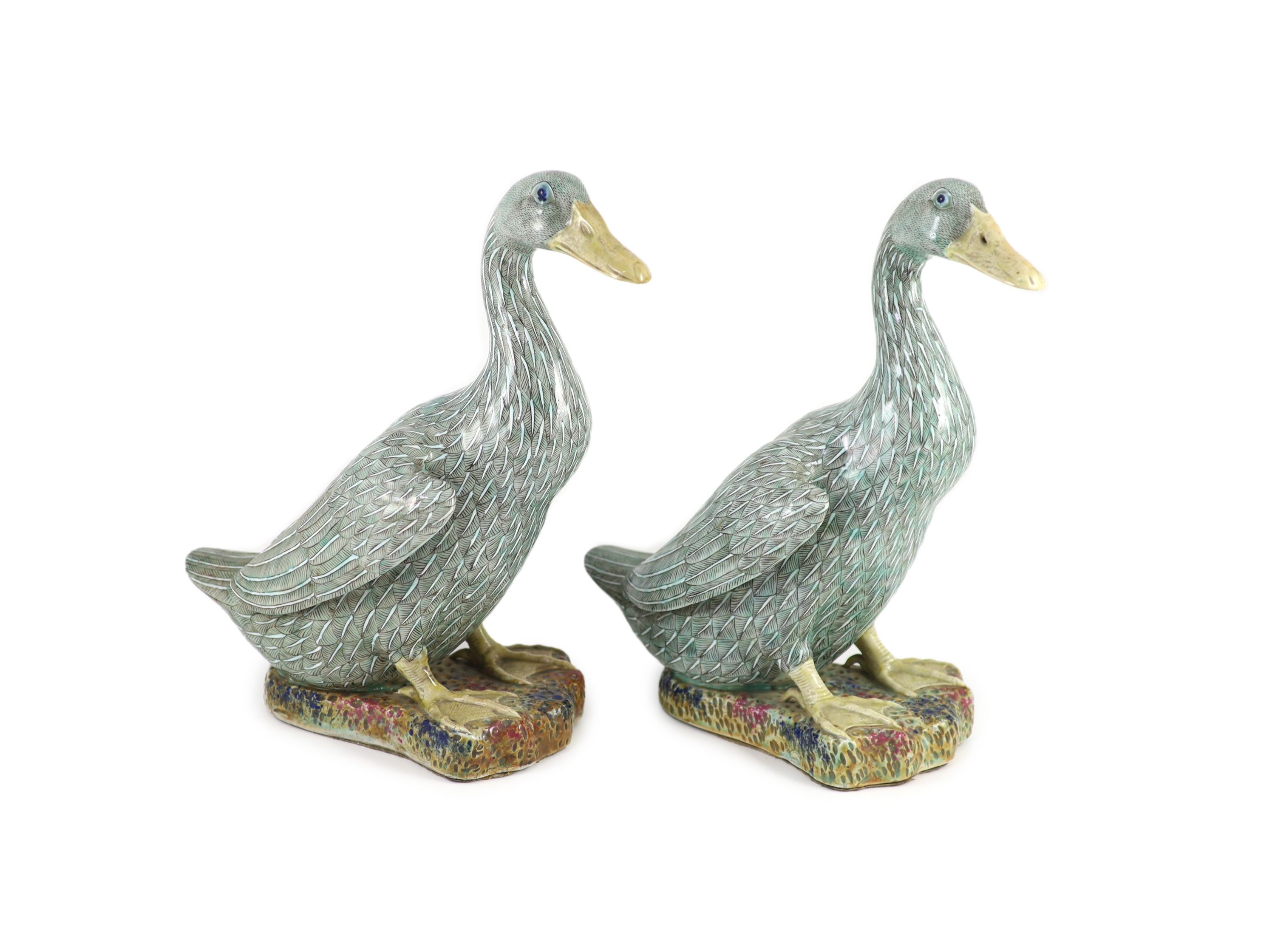 A pair of Chinese famille verte enamelled porcelain models of ducks, 19th century, 30.5 cm high